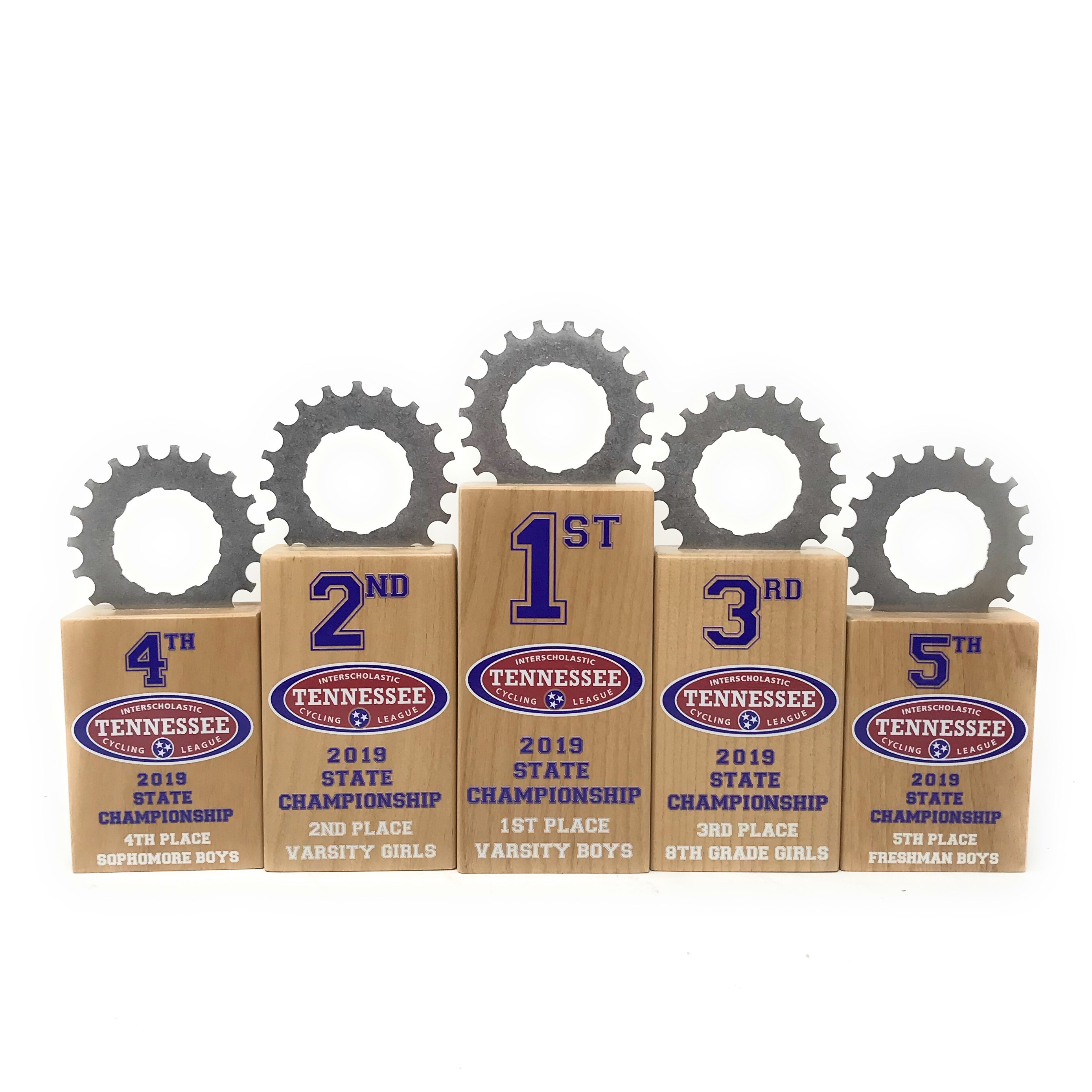 Five Elite Series alder wood block trophies stepped 1st through 5th place for the Tennessee Interscholastic Cycling League state championship, each topped with a reclaimed steel cog